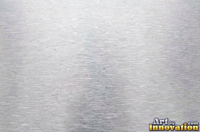 Coarse brushed finish with deep grain lines in dark gunmetal