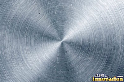 Coarse brushed finish with deep grain lines in dark gunmetal