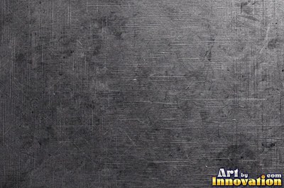 Coarse brushed finish with deep grain lines in dark gunmetal