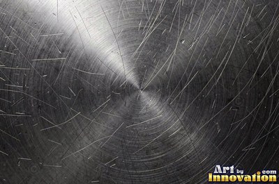 Hammered mirror finish breaking reflections into hundreds of facets