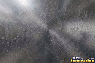 Mirror polished metal reflecting soft abstract gradients of light