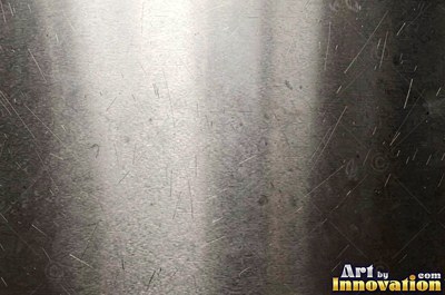 Polished gunmetal with a smoky gradient fading from bright to dark