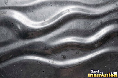 Hammered mirror finish breaking reflections into hundreds of facets