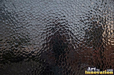Mirror polished metal reflecting soft abstract gradients of light