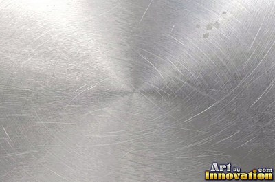 Hammered mirror finish breaking reflections into hundreds of facets