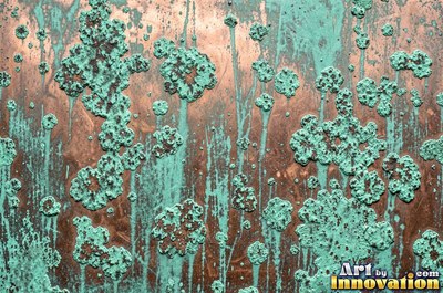 Crusty mint green verdigris built up in thick blooms on copper