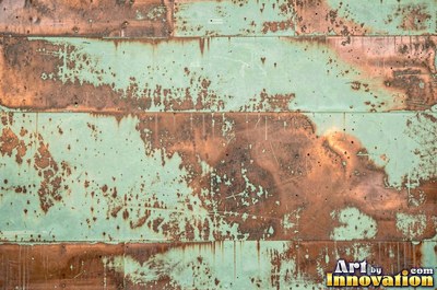 Copper roof panel with drips of patina running down it