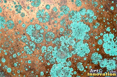 Copper roof panel with drips of patina running down it
