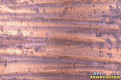 Hammered rose copper with dark recesses and bright high points