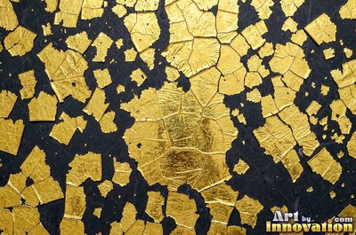 Crinkled gold leaf laid in overlapping squares with fine seams