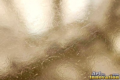 Brushed gold with a straight fine grain and a warm sheen