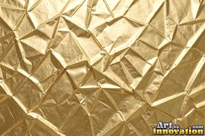 Crinkled gold leaf laid in overlapping squares with fine seams