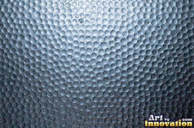 Hand hammered pewter sheet covered in overlapping round dimples