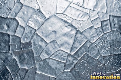 Planished metal with faint flat facets in a regular grid