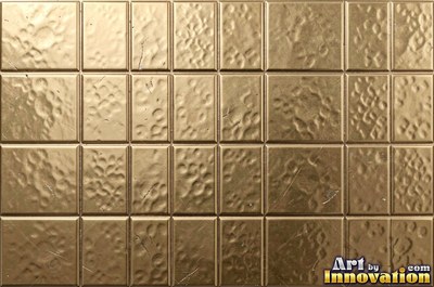 Planished metal with faint flat facets in a regular grid