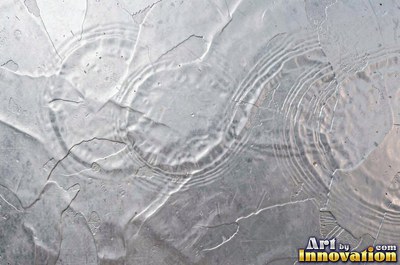 Hand hammered pewter sheet covered in overlapping round dimples