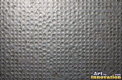 Stainless hammered metal tiles with a raised rim around each square
