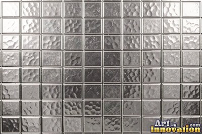 Large shallow hammer marks catching light like ripples on water