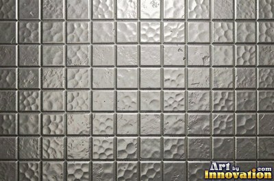 Stainless hammered metal tiles with a raised rim around each square