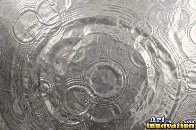 Planished metal with faint flat facets in a regular grid