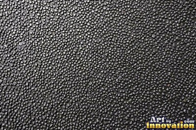 Stainless hammered metal tiles with a raised rim around each square