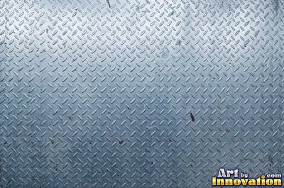 Perforated metal sheet with round holes in a tight grid of blackened iron