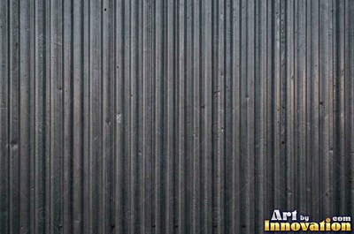 Industrial metal with chipped hazard stripes worn back to bare metal