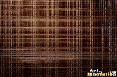 Perforated metal sheet with round holes in a tight grid of blackened iron
