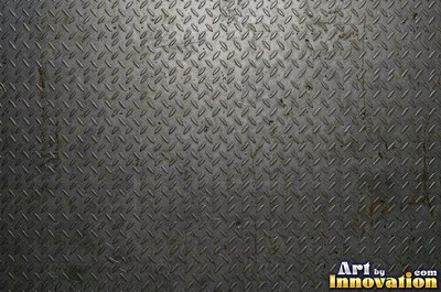 Welded steel surface with weld beads and grinding marks