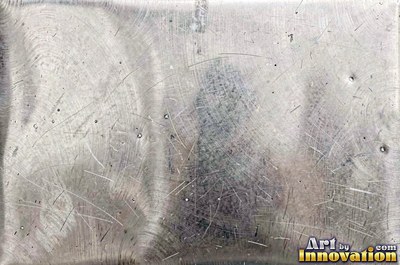 Industrial metal with chipped hazard stripes worn back to bare metal