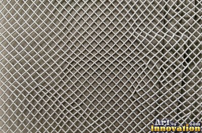 Industrial metal with chipped hazard stripes worn back to bare metal