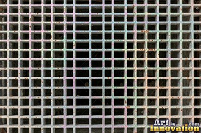 Industrial metal with chipped hazard stripes worn back to bare metal