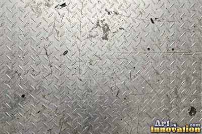 Welded steel surface with weld beads and grinding marks