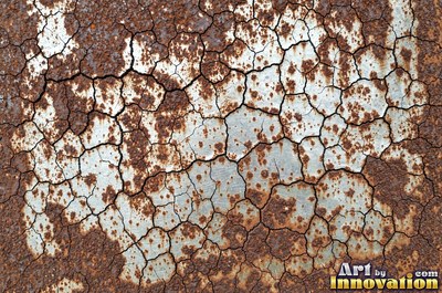 Corroded iron with streaks of rust running down from bolt holes