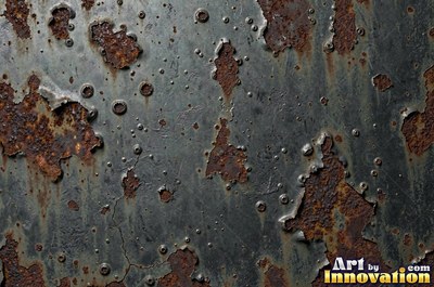 Layered rust surface of orange, brown and black flakes