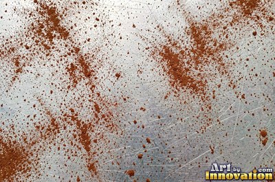Rust bubbling up under old paint with blisters bursting open