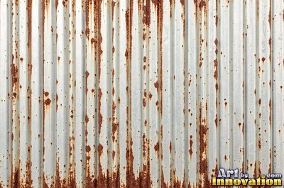 Rust bubbling up under old paint with blisters bursting open