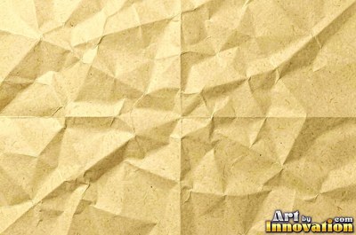 Folded paper in a regular geometric crease pattern