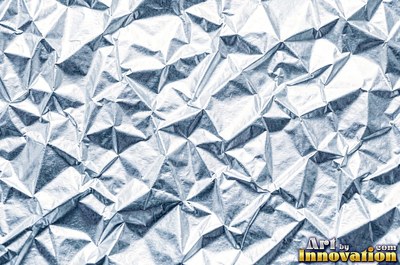 Folded paper in a regular geometric crease pattern