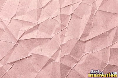 Folded paper in a regular geometric crease pattern