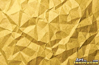 Crumpled paper smoothed out with a web of sharp creases in aged ivory