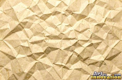 Crumpled foil paper catching bright highlights in pale blue
