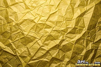 Crumpled paper smoothed out with a web of sharp creases in aged ivory