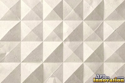Folded paper in a regular geometric crease pattern