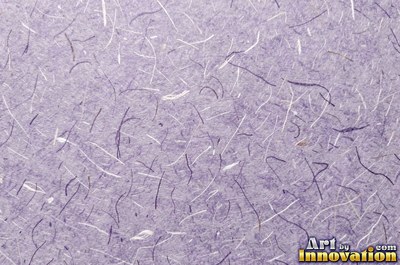 Lavender paper with embedded seeds and plant flecks