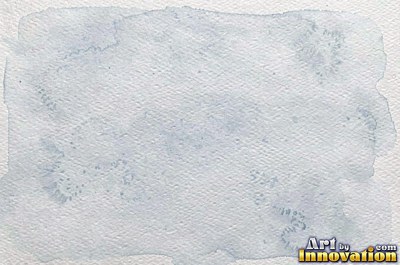 Off-white paper with pressed flower petals embedded in it