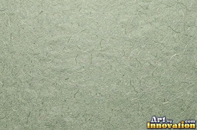 Lavender paper with embedded seeds and plant flecks