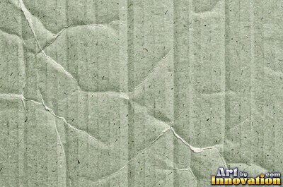 Crushed charcoal black cardboard with dents and folds