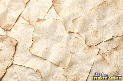 Aged parchment with mottled stains and darker edges