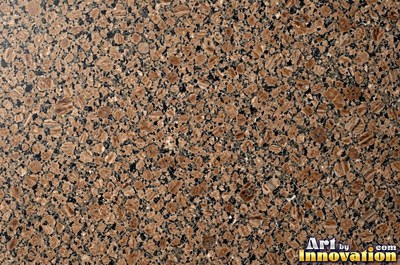 Polished granite with dense speckles of mineral crystals in warm beige
